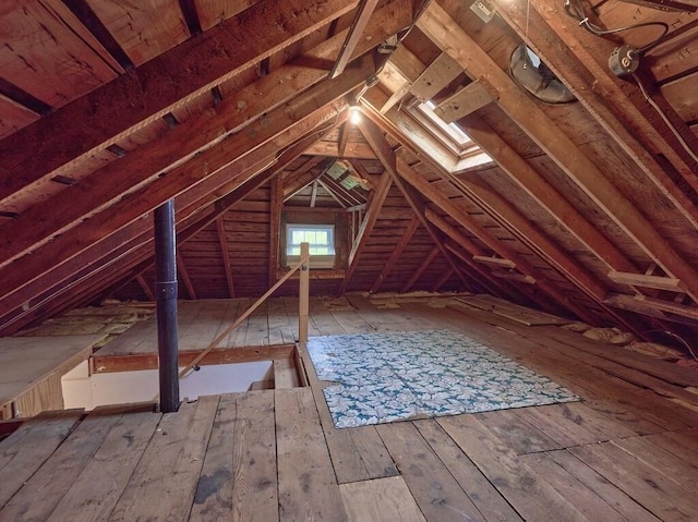 attic featuring an upstairs landing