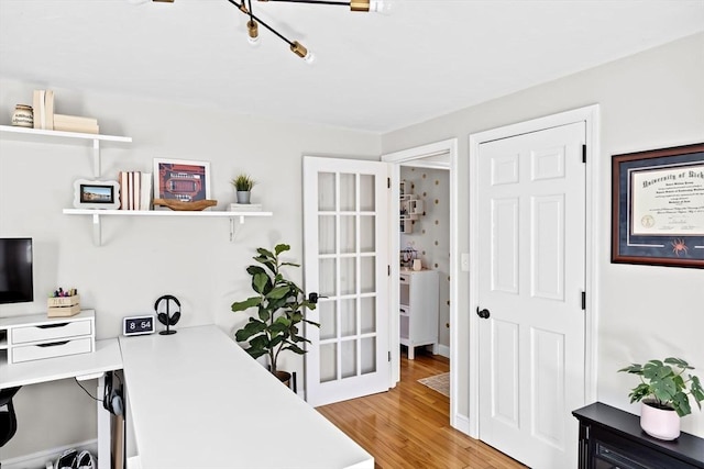 home office with light wood finished floors