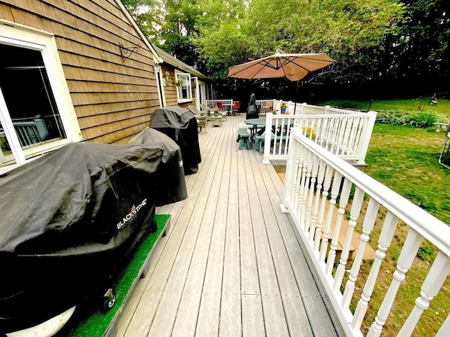 64 Broad St, Rehoboth, MA 02769 - wooden deck featuring outdoor dining space, a lawn, and grilling area