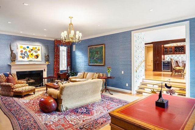 living room with a notable chandelier, crown molding, and wine cooler