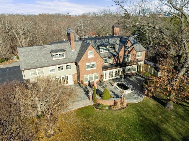 back of house featuring a yard