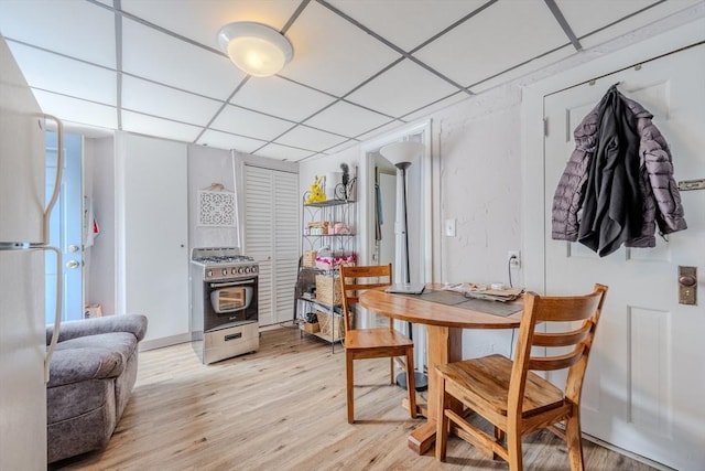 72 Wright St, Stoneham, MA 02180 - dining space with light wood-style floors and a paneled ceiling