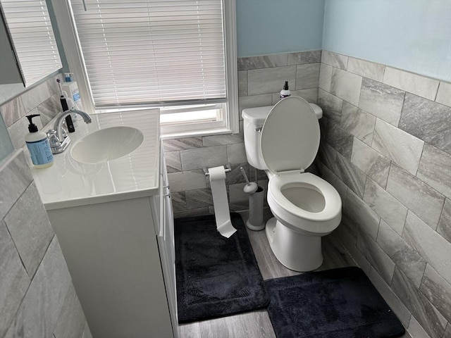 72 Wright St, Stoneham, MA 02180 - half bathroom featuring tile walls, vanity, and toilet
