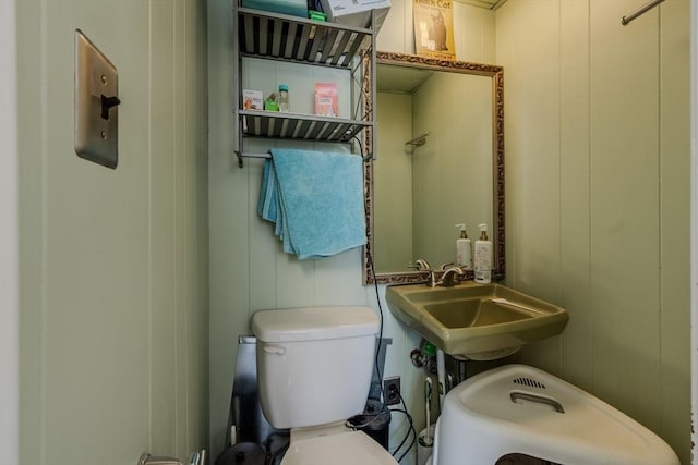 72 Wright St, Stoneham, MA 02180 - half bathroom with a sink, toilet, and a decorative wall