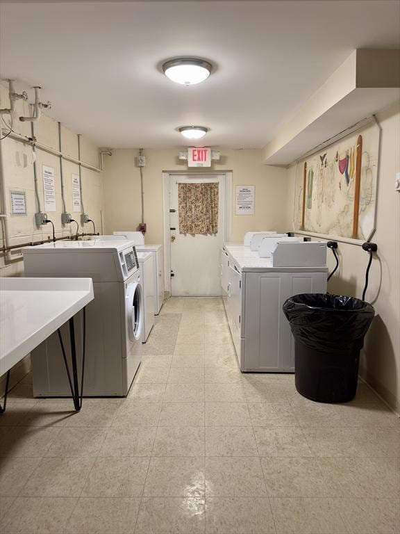 community laundry room with independent washer and dryer