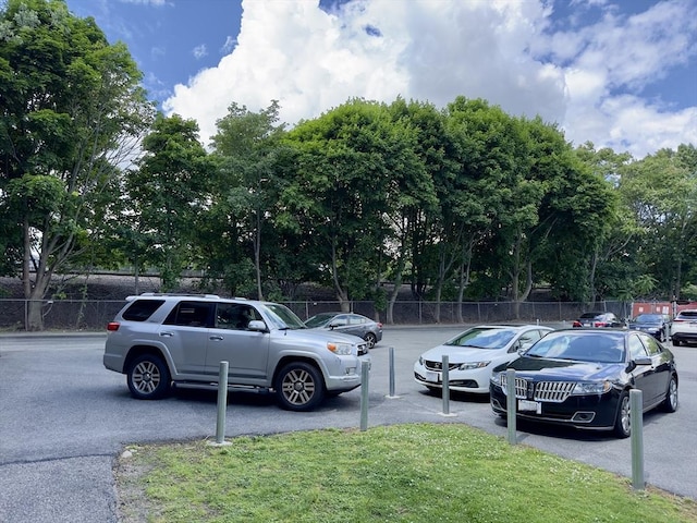 uncovered parking lot with fence