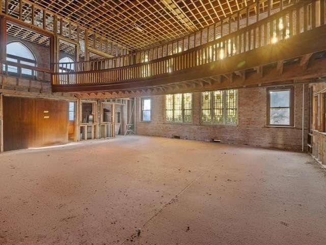 miscellaneous room with a towering ceiling