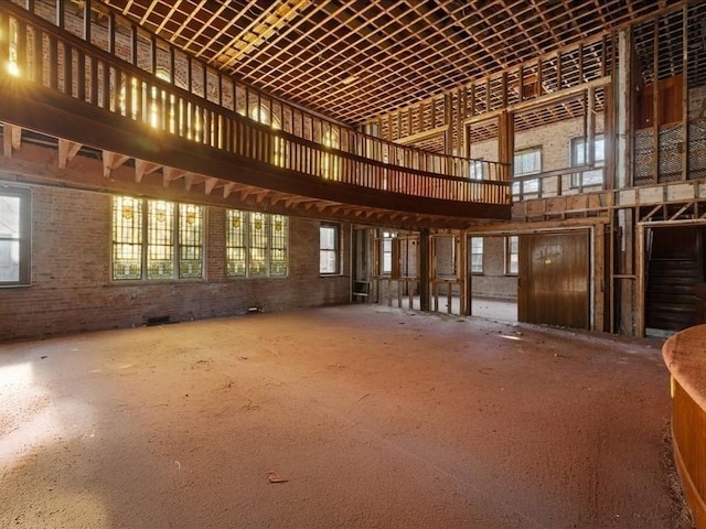 misc room featuring a wealth of natural light and a towering ceiling