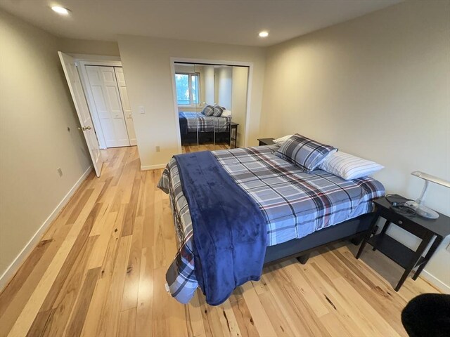 bedroom with recessed lighting, baseboards, and light wood finished floors
