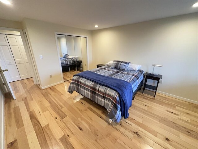 bedroom featuring recessed lighting, baseboards, a closet, and light wood-type flooring