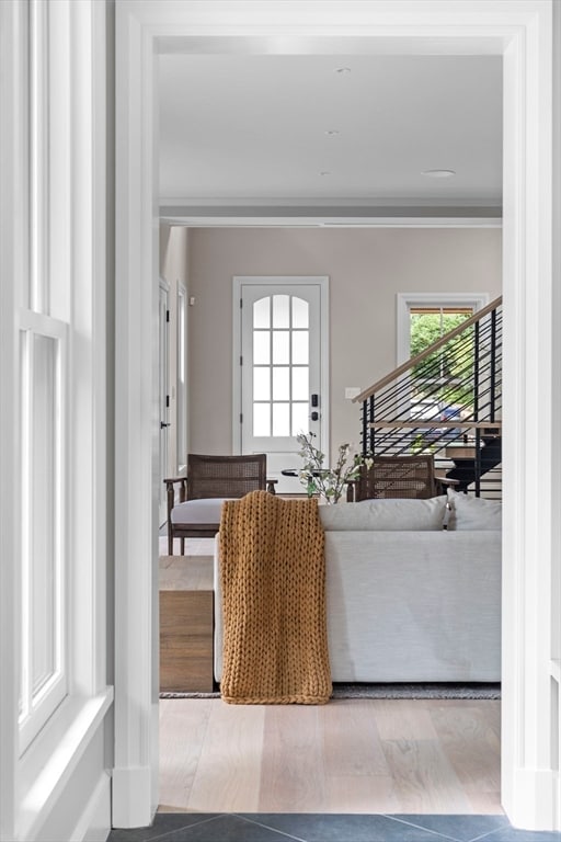 living room featuring hardwood / wood-style floors and ornamental molding