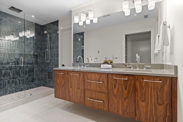 bathroom with tile patterned flooring, double vanity, crown molding, and walk in shower