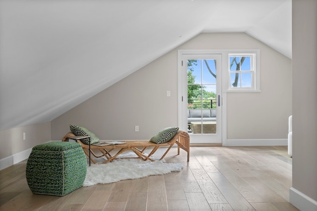 bonus room featuring light hardwood / wood-style floors and vaulted ceiling