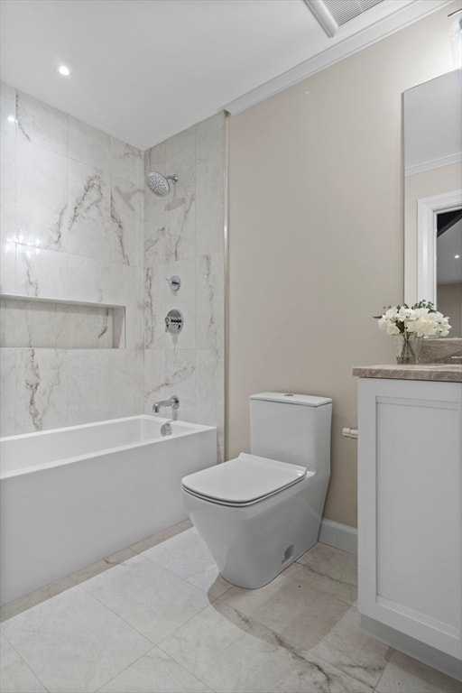 full bathroom with tiled shower / bath, ornamental molding, tile patterned flooring, vanity, and toilet