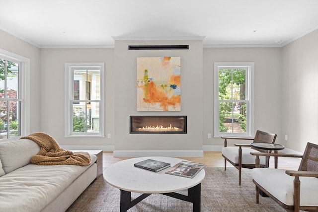 living room featuring a wealth of natural light and crown molding