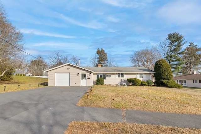 single story home with a garage and a front yard