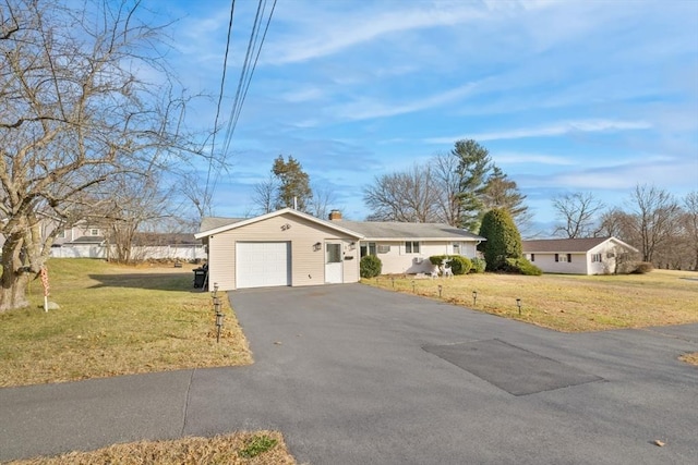 single story home with a front lawn and a garage