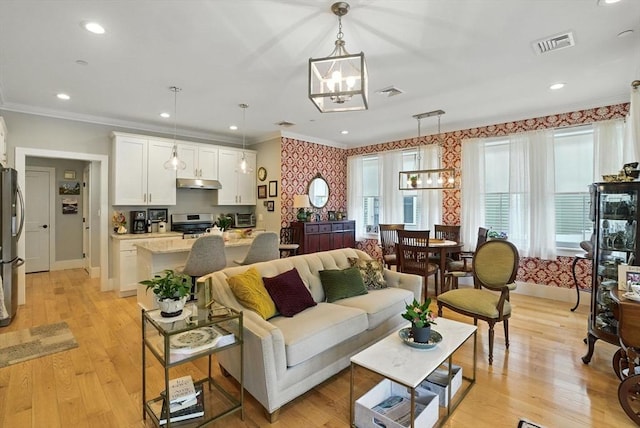 132 High St Unit B, Newburyport, MA 01950 - living area featuring a chandelier, wallpapered walls, ornamental molding, light wood finished floors, and recessed lighting
