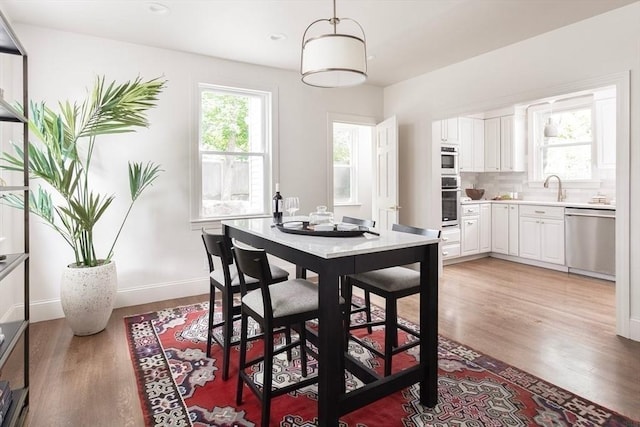151 Salisbury Rd, Brookline, MA 02445 - dining area with light wood-style floors and recessed lighting
