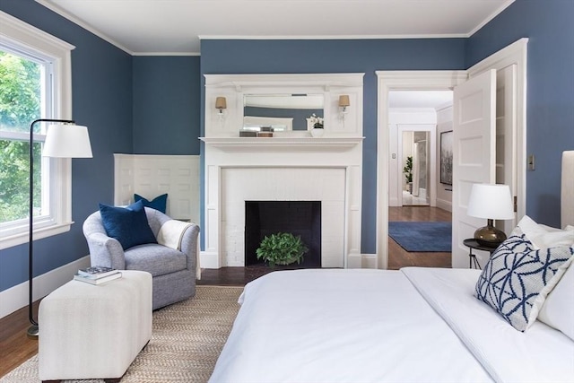 151 Salisbury Rd, Brookline, MA 02445 - bedroom featuring wood finished floors, ornamental molding, and a fireplace