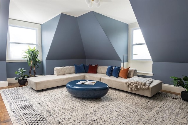 151 Salisbury Rd, Brookline, MA 02445 - living area featuring healthy amount of natural light, vaulted ceiling, and wood finished floors