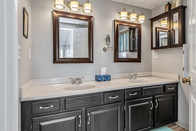 bathroom with a sink and double vanity