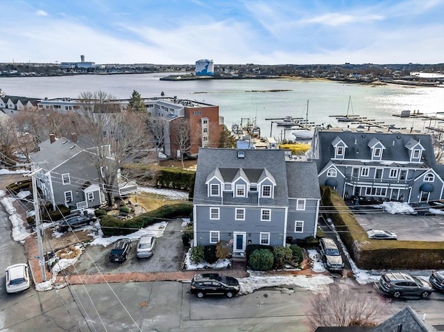 birds eye view of property with a water view