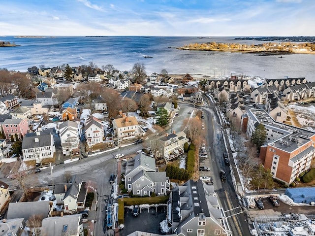 bird's eye view with a residential view and a water view