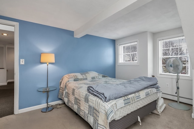 bedroom with a baseboard heating unit, beam ceiling, carpet floors, and baseboards