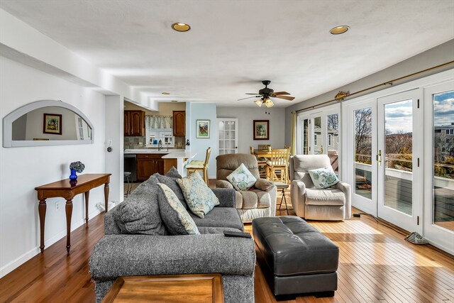 living area featuring french doors, recessed lighting, a ceiling fan, baseboards, and hardwood / wood-style flooring