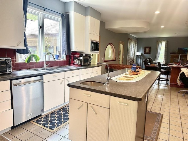 201 Main Rd, Williamsburg, MA 01039 - kitchen featuring dishwasher, dark countertops, open floor plan, light tile patterned flooring, and built in microwave