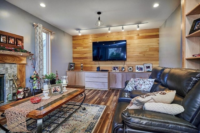 201 Main Rd, Williamsburg, MA 01039 - living area with wood walls, dark wood-style floors, a stone fireplace, and recessed lighting
