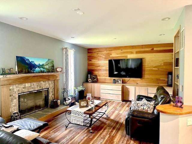 201 Main Rd, Williamsburg, MA 01039 - living area with a tile fireplace, wood finished floors, wood walls, and recessed lighting