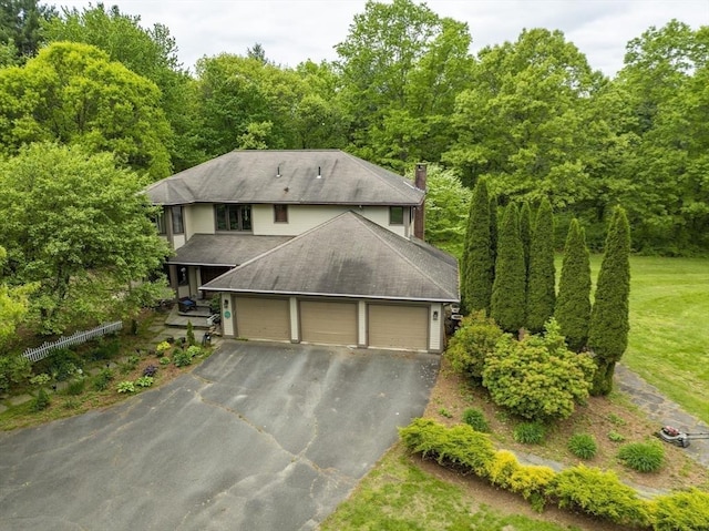 201 Main Rd, Williamsburg, MA 01039 - view of front facade with a chimney, roof with shingles, driveway, and a garage