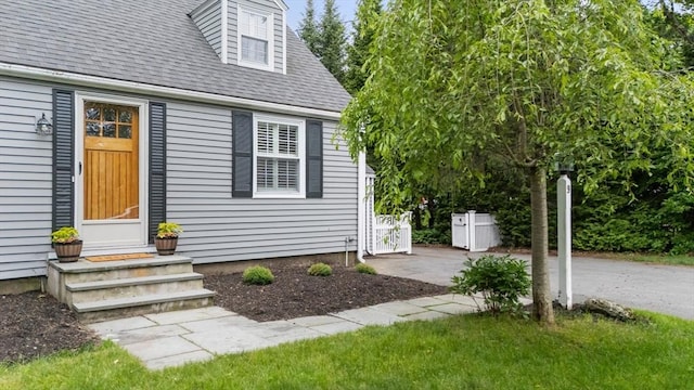 9 Oak St, Wayland, MA 01778 - property entrance with a shingled roof