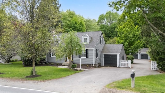 9 Oak St, Wayland, MA 01778 - cape cod-style house with a garage, a front lawn, roof with shingles, and driveway