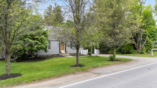 9 Oak St, Wayland, MA 01778 - obstructed view of property with a front yard