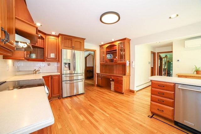493 Salisbury St, Worcester, MA 01609 - kitchen featuring stainless steel appliances, open shelves, a baseboard radiator, light wood-style flooring, and recessed lighting