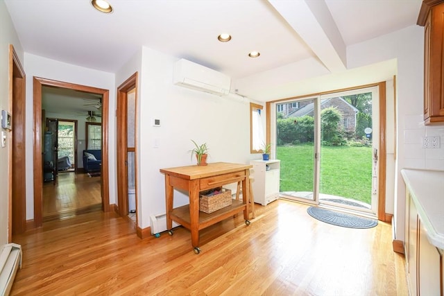 493 Salisbury St, Worcester, MA 01609 - foyer entrance featuring an AC wall unit, a baseboard radiator, light wood-style floors, plenty of natural light, and recessed lighting