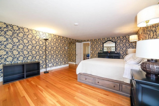 493 Salisbury St, Worcester, MA 01609 - bedroom with wallpapered walls, light wood finished floors, and baseboards