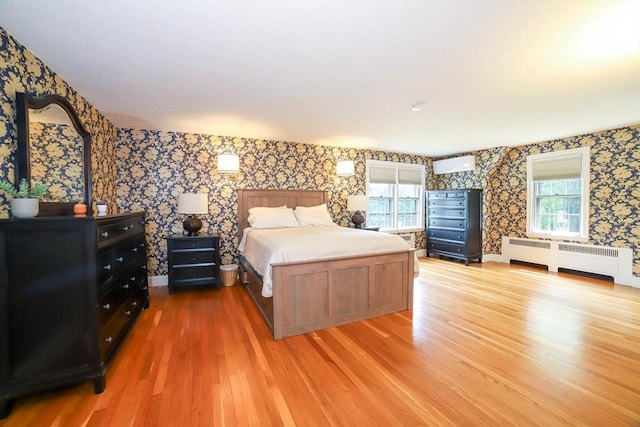 493 Salisbury St, Worcester, MA 01609 - bedroom featuring wallpapered walls, light wood finished floors, and radiator heating unit