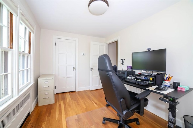 493 Salisbury St, Worcester, MA 01609 - office area with radiator, light wood-type flooring, and baseboards
