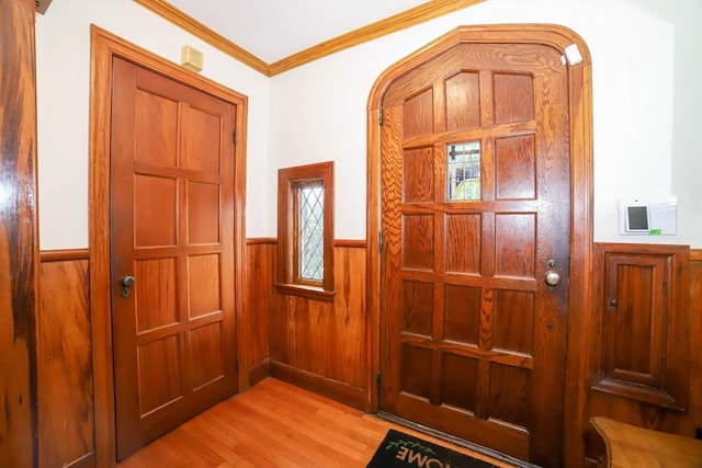 493 Salisbury St, Worcester, MA 01609 - entrance foyer with wainscoting, light wood finished floors, ornamental molding, and wooden walls