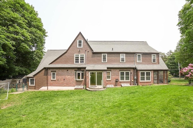 493 Salisbury St, Worcester, MA 01609 - back of property featuring brick siding and a patio