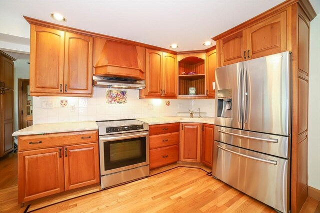 493 Salisbury St, Worcester, MA 01609 - kitchen with stainless steel appliances, premium range hood, light wood-type flooring, and recessed lighting
