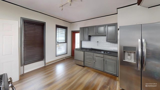 1-3 River Pl, Methuen, MA 01844 - kitchen featuring stainless steel refrigerator with ice dispenser, dishwashing machine, light wood-type flooring, track lighting, and decorative backsplash
