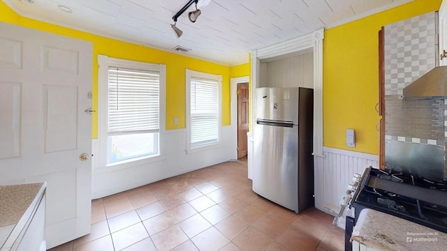 1-3 River Pl, Methuen, MA 01844 - kitchen featuring freestanding refrigerator, a wainscoted wall, light tile patterned floors, track lighting, and gas range