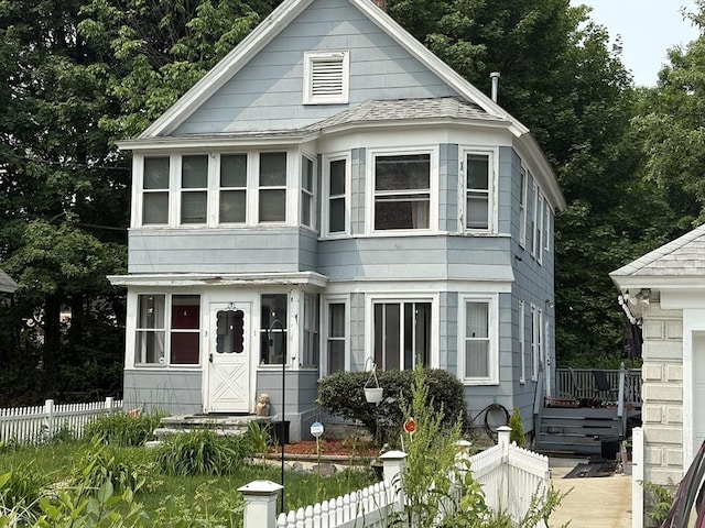 1-3 River Pl, Methuen, MA 01844 - view of front of house with a fenced front yard and roof with shingles