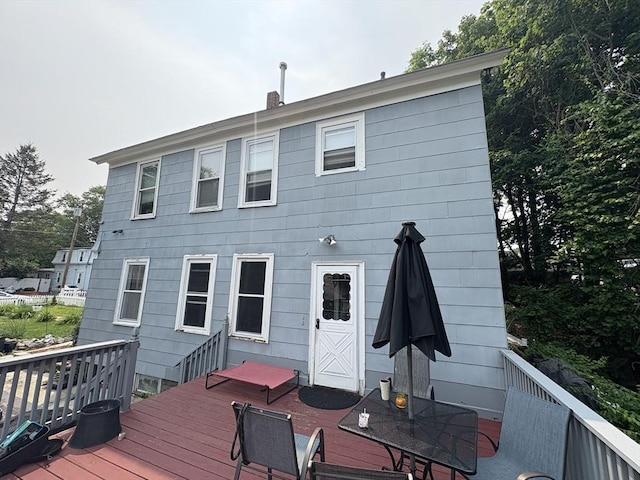 1-3 River Pl, Methuen, MA 01844 - back of property with a wooden deck, outdoor dining space, and a chimney