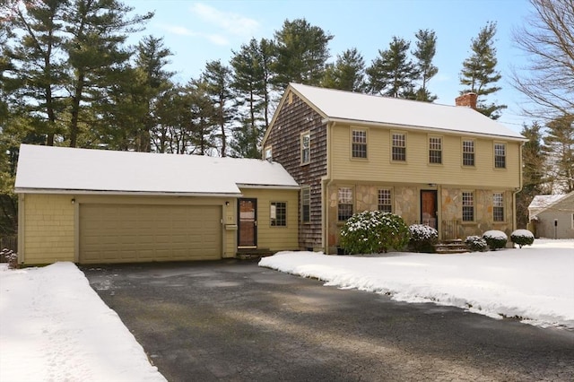 colonial inspired home with a garage